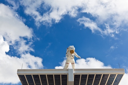 ORLANDO, USA - JULY 25: an Astronaut in his Space suit is watching the entrance of the Kennedy space center  on July 25, 2010 in Orlando, USA.のeditorial素材