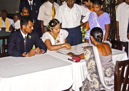 SIGIRIYA, SRI LANKA - JULY 30:  Typical Wedding ceremony with wedding registry in the Hotel with the family and invited guests  on July 30, 2005 in Sigiriya, Sri Lanka.のeditorial素材