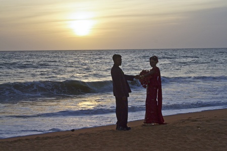 COLOMBO,  SRI LANKA - JUL 30:  Married couple  at the beach with the bridal flowers on their wedding day in sunset in Love on July 30, 2005 in Colombo, Sri Lanka.のeditorial素材
