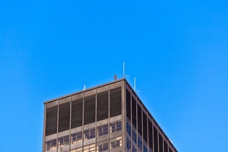 NEW YORK, USA - JULY 7: Facade of Empire State Building in the afternoon with iron statue of Man from atist Antony Gormley on the roof on July 7,2010 in New York, USA.のeditorial素材
