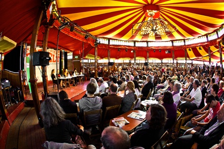 FRANKFURT, GERMANY - OCTOBER 10: public day for Frankfurt Book fair, spectators are listening the authors in the reading tent on October 10, 2010 in Frankfurt, Germany.のeditorial素材