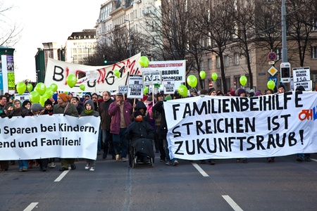 VIENNA, AUSTRIA - NOVEMBER 27: thousands are demonstrating peaceful against cutting of social spenditures by the governement specially for kids and families on  November 27, 2010 in Vienna, Austria.のeditorial素材