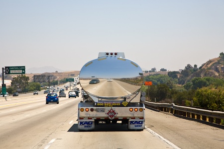 LOS ANGELES, USA - JULY 06:  Reflection of a car 9n a chrome truck transporting liquids on the highway on July 06, 2008 in Los Angeles, USA.のeditorial素材
