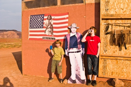 MONUMENT VALLEY, AMERICA - JULY 12:  family is posing  with a picture of John Wayne at John Fords place in monument valley on July 12,2008.のeditorial素材