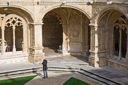 beautiful Jeronimos Monastery in Lisbon, Belem, boy sitting on a stone pillarのeditorial素材