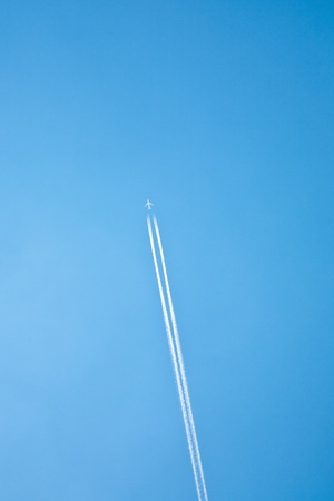 condensation trail on blue skyの写真素材