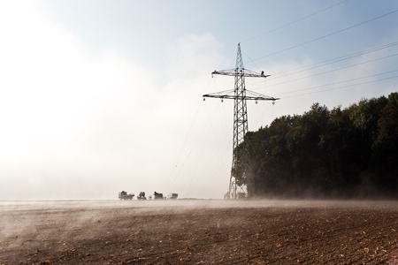 a pylon will be setted up in foggy weather in beautiful landscape with acres in fog