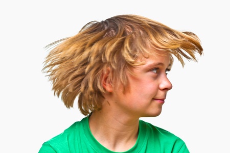 happy  cute boy with flowing hairの写真素材