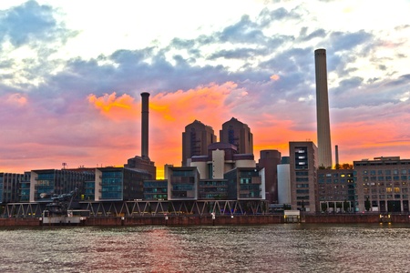 cityview of Frankfurt with river Main and new appartments and office buildings at the riverside at...