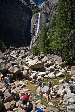 YOSEMITE, USA - JULY 22: people enjoy the waterfall at Upper and lower Yosemite falls with a powerful spring at July 22, 2008 in Yosemite, USA. Yosemite is one of the most famous national Parks in the US.のeditorial素材