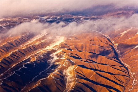 beautiful view from the aircraft to the mountains of the Himalaya on Chinese Tibetan side snowの写真素材