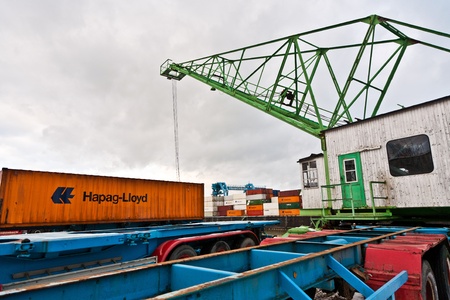 MAINZ, GERMANY - JANUARY 1: crane and container in harbor in Winter on January, 1, 2010 in Mainz, Germany. The harbor was build by Eduard Kreyssig in 1887 and the new cranes added in 1961.のeditorial素材