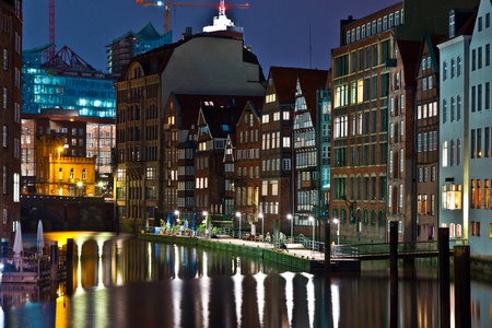 old townhouses at the canal in Hamburg by nightの写真素材