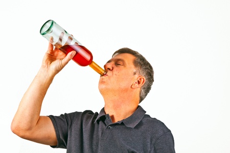 cute boy drinking water out of a glassの写真素材