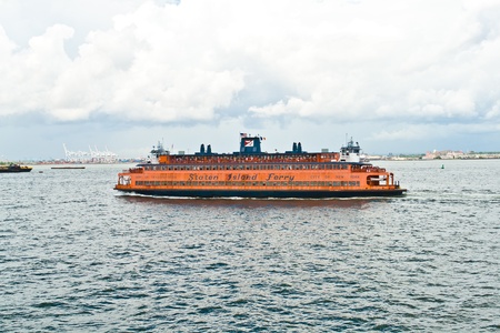 NEW YORK - SEP 07: Staten Island Ferry cruises the bay on afternoon of September 07,2010 in NEW YORK. The Staten Island Ferry The Staten Island Ferry provides 20 million people a year and is free of charge.のeditorial素材