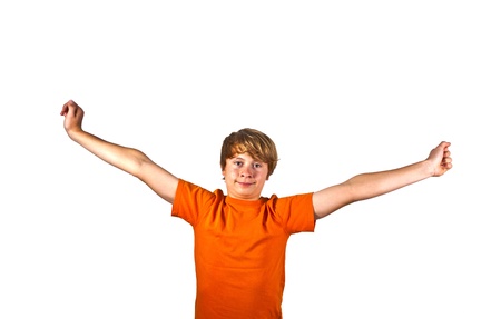 portrait of cute boy with orange shirt gesturing with his armsの写真素材