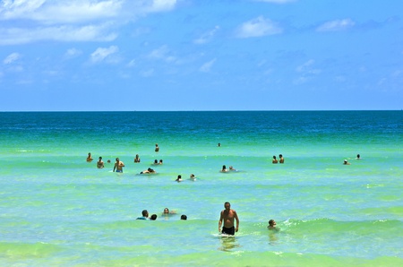 MIAMI BEACH, USA - JULY 27: People enyoy the beach and swimming in South Beach on July 27,2010 in Miami Beach, Florida. This area was the first section of Miami Beach to be developed, starting in the 1910s.のeditorial素材