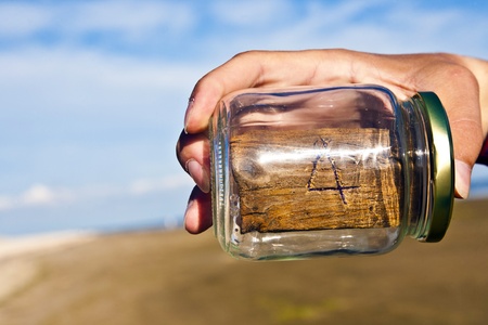 peace of wood with an engraved number with blue skyの写真素材