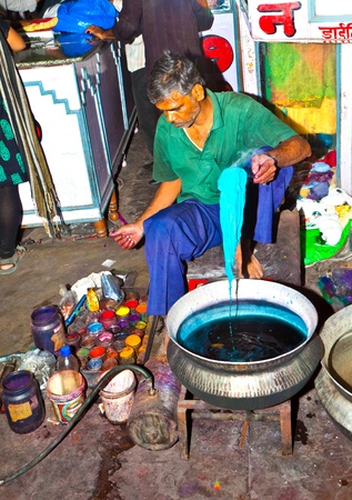 JAIPUR, INDIA - NOVEMBER 11: unidentified dyer works at outdoor factory on November 11,2011 in Jaipur, India. He dyes clothes with colors.のeditorial素材