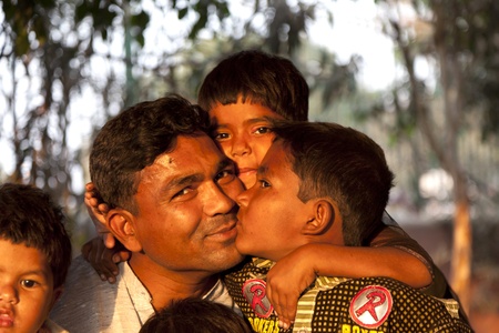 DELHI - NOVEMBER 8: proud father shows his children at the Meena Bazaar Market on November 8, 2011 in Delhi, India. Shah Jahan founded the bazaar in the 17th century.のeditorial素材