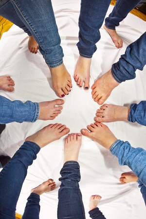 feet of girls with jeans in a circleの写真素材