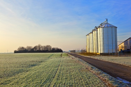 silos in the middle of a field in wintertimeのeditorial素材