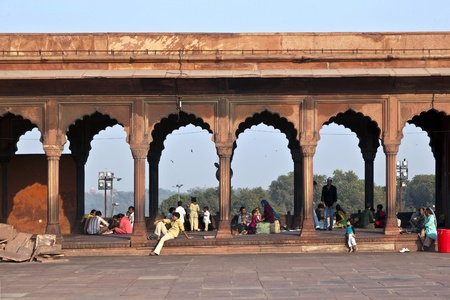 DELHI, INDIA - NOVEMBER 8: A group of worshipers rest on the courtyard of Jama Masjid Mosque in...
