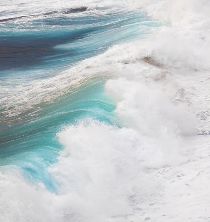 beautiful waves at the beach in sunsetの写真素材