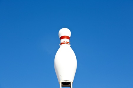 bowling pin in blue sky as symbol for a bowling place