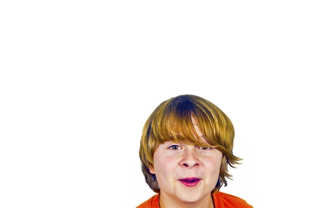 happy boy in Studio shaking his head  isolated on whiteの写真素材