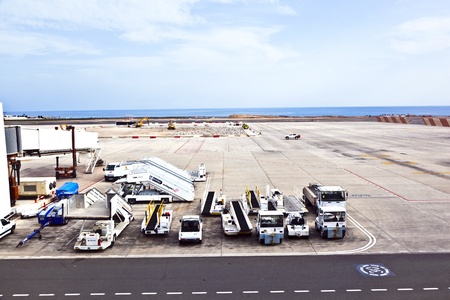 ARRECIFE, SPAIN - JANUARY 4: apron and runway with equipment on January 4,2011 in Arrecife, Spain. In 1999 a new passenger terminal opened  with a capacity of 6 million passengers per annum.のeditorial素材