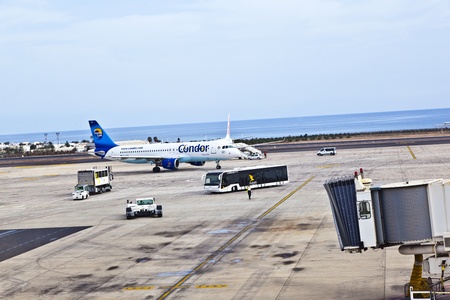 ARRECIFE, SPAIN - JANUARY 4: people board the flight home on January 4,2011 in Arrecife, Spain. In 1999 a new passenger terminal opened  with a capacity of 6 million passengers per annum.のeditorial素材