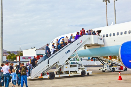 ARRECIFE, SPAIN - JANUARY 4: people board the flight home on January 4,2011 in Arrecife, Spain. In 1999 a new passenger terminal opened  with a capacity of 6 million passengers per annum.のeditorial素材