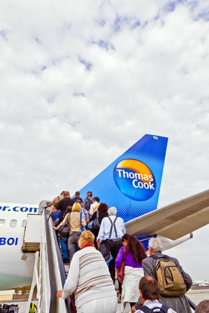ARRECIFE, SPAIN - JANUARY 4: people board the flight home on January 4,2011 in Arrecife, Spain. In 1999 a new passenger terminal opened  with a capacity of 6 million passengers per annum.のeditorial素材
