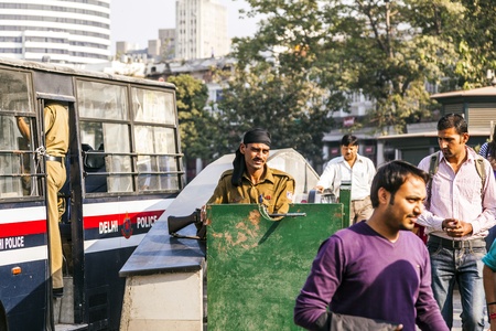 NEW DELHI - NOVEMBER 11: Policemen guard Connaught Place permanently after the firing incident on September 19, 2010 where tourists were injured on November 11,2011 in New Delhi.のeditorial素材