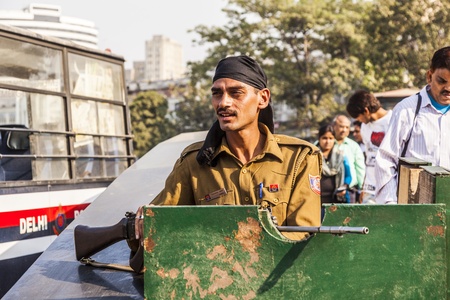NEW DELHI - NOVEMBER 11: Policemen guard Connaught Place permanently after the firing incident on September 19, 2010 where tourists were injured on November 11,2011 in New Delhi.のeditorial素材