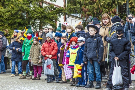 SCHWALBACH, GERMANY - FEBRUARY 27: The people watch the carnival parade on February 27, 2011 in Schwalbach, Germany. The parade is the annual event in the city and people like to collect sweets.のeditorial素材