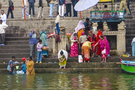 VARANASI - INDIA, JANUARY 1: Hindu people wash themselves in the river Ganga in the holy city of Varanasi. The holy ritual of washing is held every day on January 1,2012 in Varanasi, India.のeditorial素材