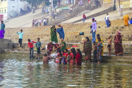 VARANASI - INDIA, JANUARY 1: Hindu people wash themselves in the river Ganga in the holy city of Varanasi. The holy ritual of washing is held every day on January 1,2012 in Varanasi, India.のeditorial素材