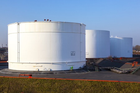 white tank in tank farm with blue skyのeditorial素材
