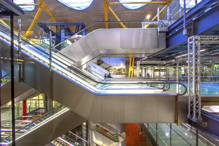 MADRID - APRIL 1: Passengers walk by at the new terminal T4 at Barajas airport on April 1,2012 in Madrid. This addition opened 2006 makes Madrid the 2. largest airport in the world.のeditorial素材