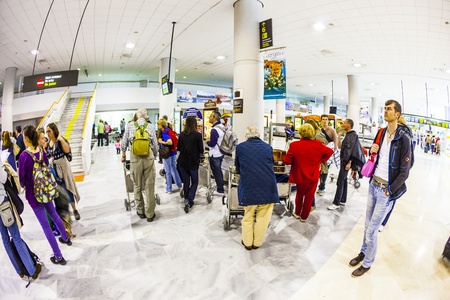 ARRECIFE, SPAIN - APRIL 1: tourists wait for their baggage from Madrid at Lanzarote Airport on April...