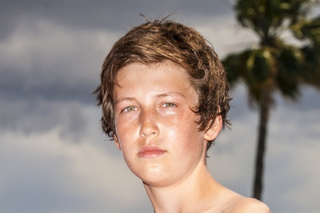 cute young boy relaxing at the poolの写真素材