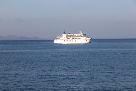 PLAYA BLANCA, SPAIN - APRIL 2: the ferry Volcan de Timanfaya ARMAS enters the harbor on April 02,2012 in Playa Blanca, Spain. It connects 6 times daily Lanzarote with Fuerteventura.のeditorial素材