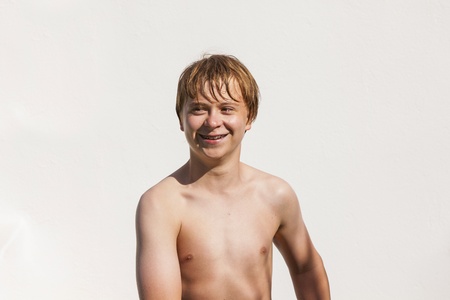 portrait of wet boy after swimming in the poolの写真素材