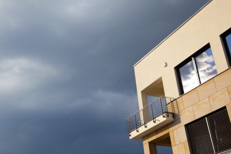 balcony of modern flat with dark clouds in rainの写真素材