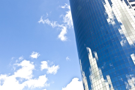 facade of Skyscraper with reflection of sky in New York