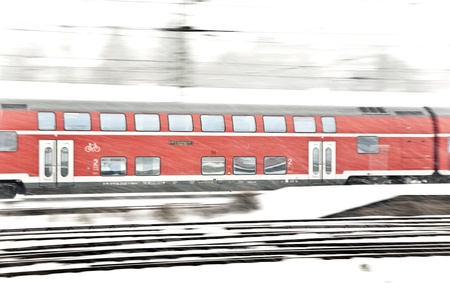 train in Wintertime on track in heavy snow flurryの写真素材