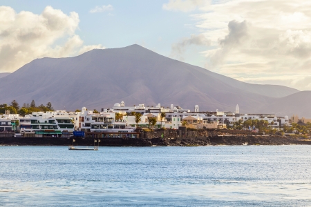 PLAYA BLANCA, SPAIN- APRIL 4: boats lying in the harbor on April 4, 2012 in Playa Blanca, Spain. Canary Islands are a favorite winter destination for Europeans.のeditorial素材