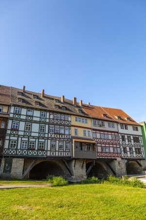 Houses on Kraemerbruecke - Merchants Bridge in Erfurt, Germany. Two narrow rows of houses are built along both sides of the bridge.のeditorial素材